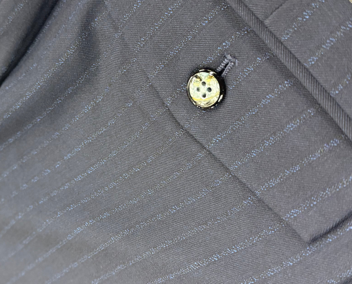Close up suit pants back pocket button detail navy pinstripe