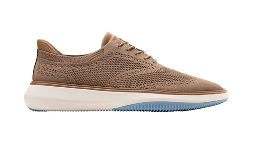 Cole Haan Coffee sneaker with a white sole on a white background Side view