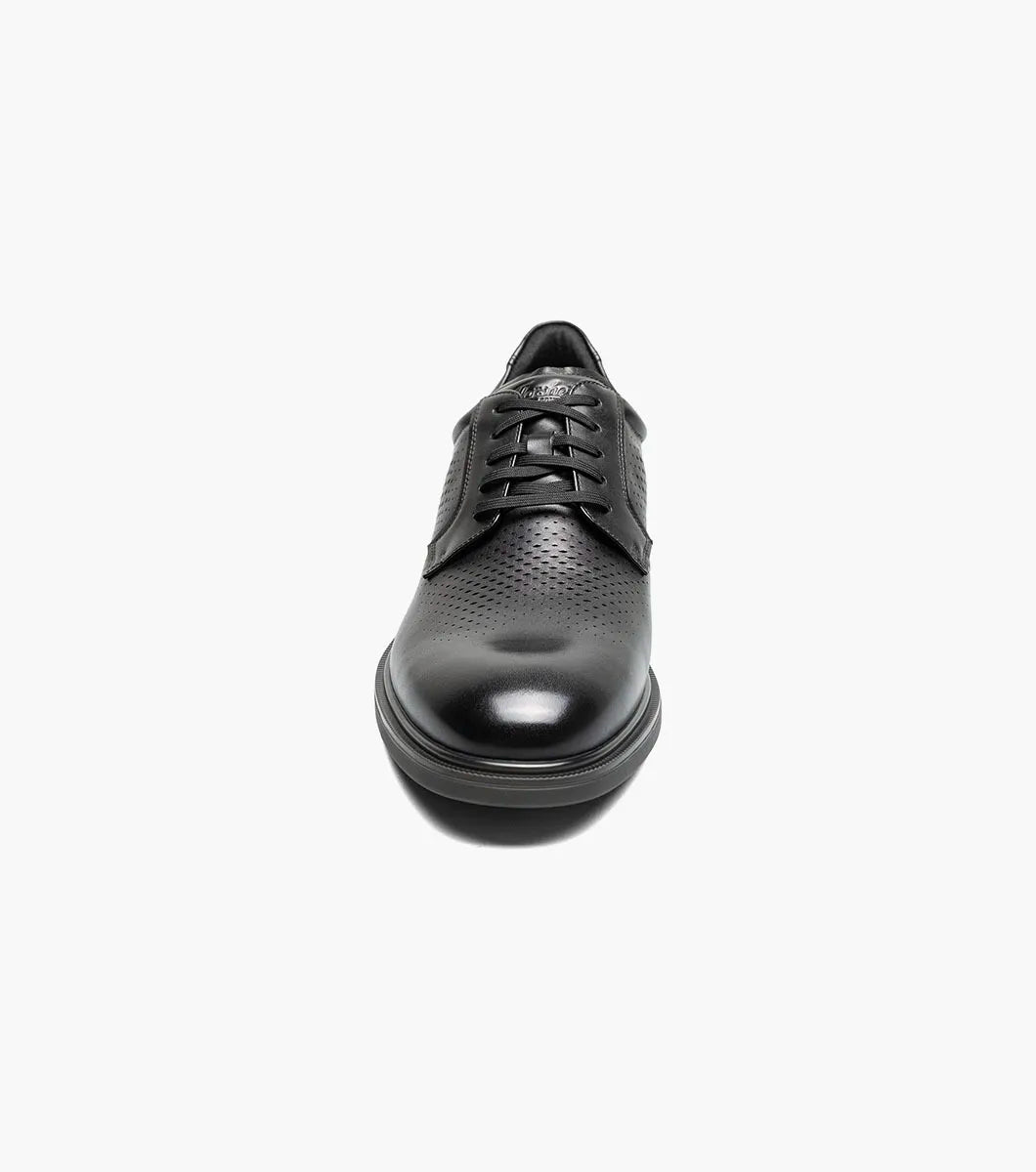 Front view of a black leather men’s lace-up dress shoe with perforated detailing across the toe.