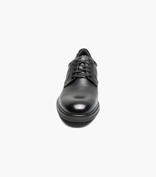 Front view of a black leather men’s lace-up dress shoe with perforated detailing across the toe.