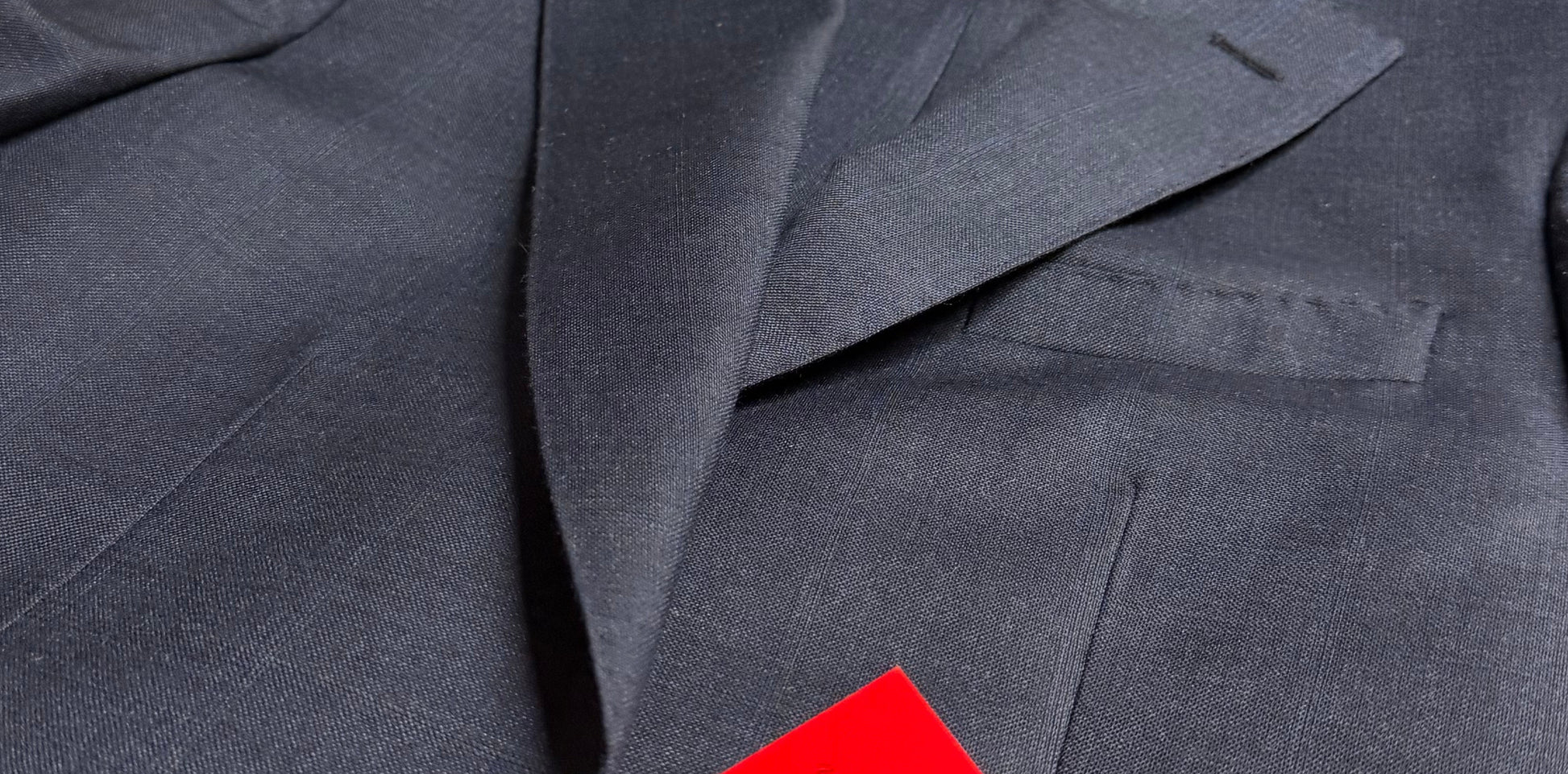 Close-up of a Navy suit jacket Plaid.

