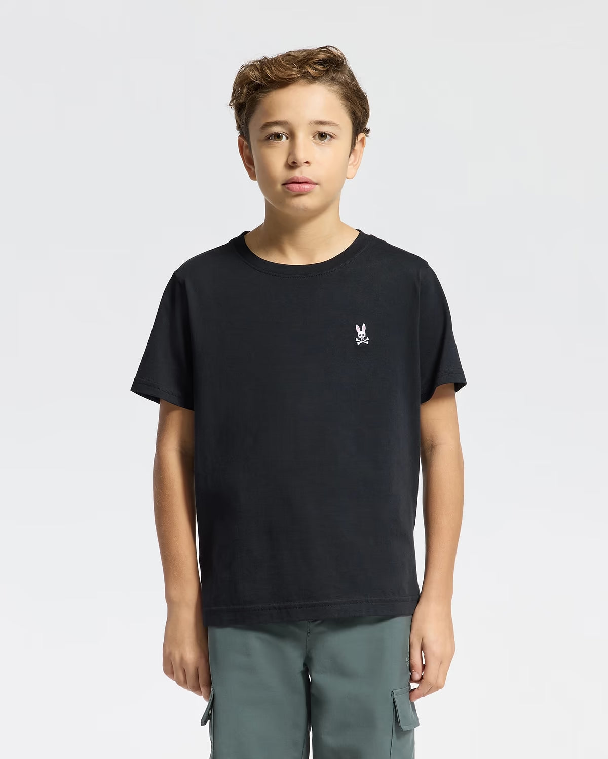 Boy wearing Psycho Bunny Kids Classic Crew Neck T-Shirt in black front view