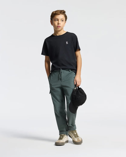 Boy wearing Psycho Bunny Kids black crew-neck tee with casual pants and bag