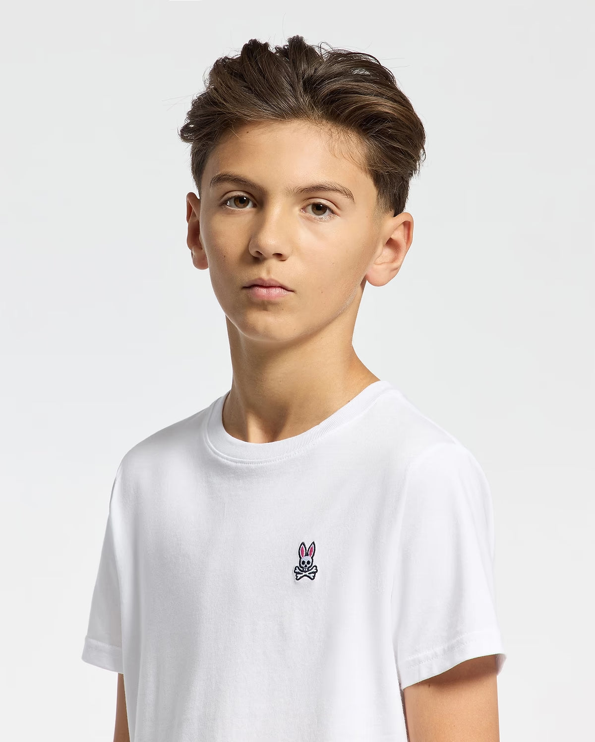 Boy modeling Psycho Bunny Kids Classic white short-sleeve T-shirt