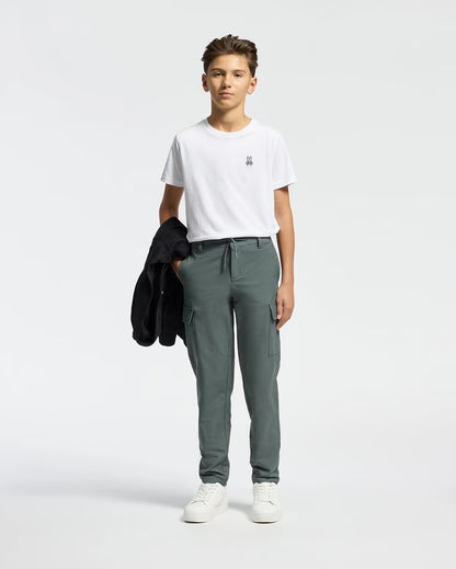 Boy wearing Psycho Bunny Kids white crew-neck tee with casual pants and bag