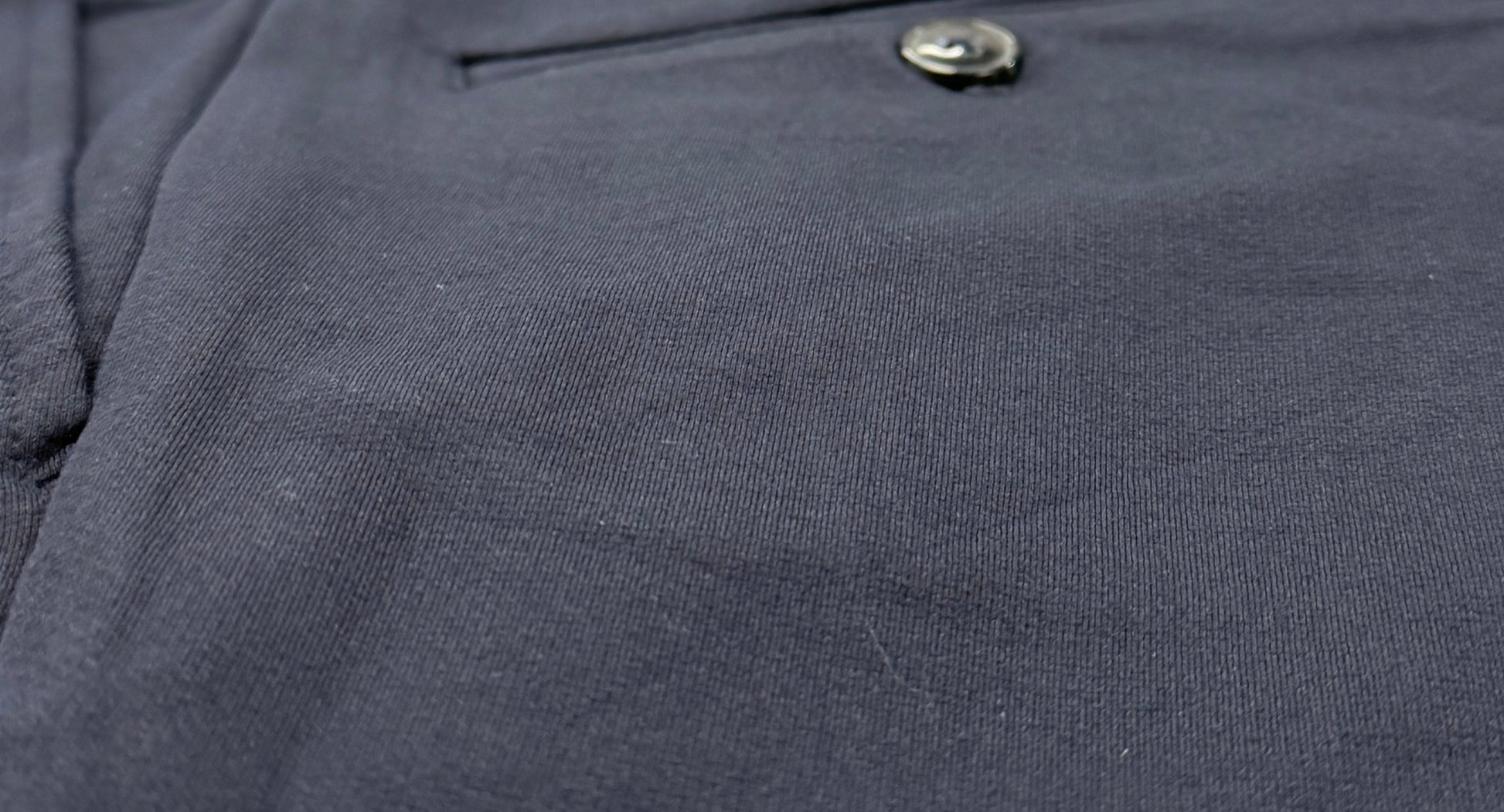 Close-up of navy a6-2 stretch pants 

