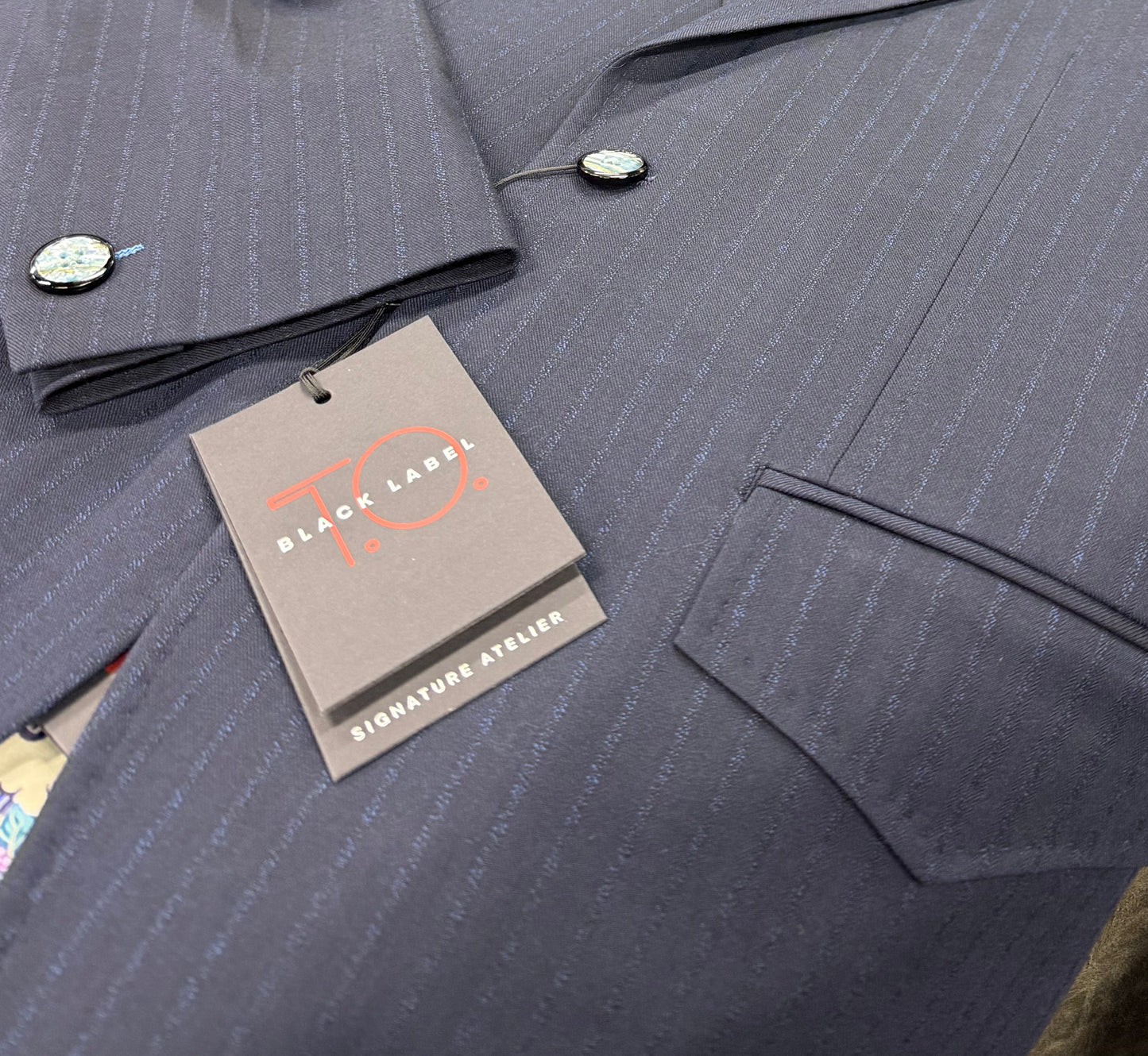 Close up navy pinstripe fabric T.O. Black Label 