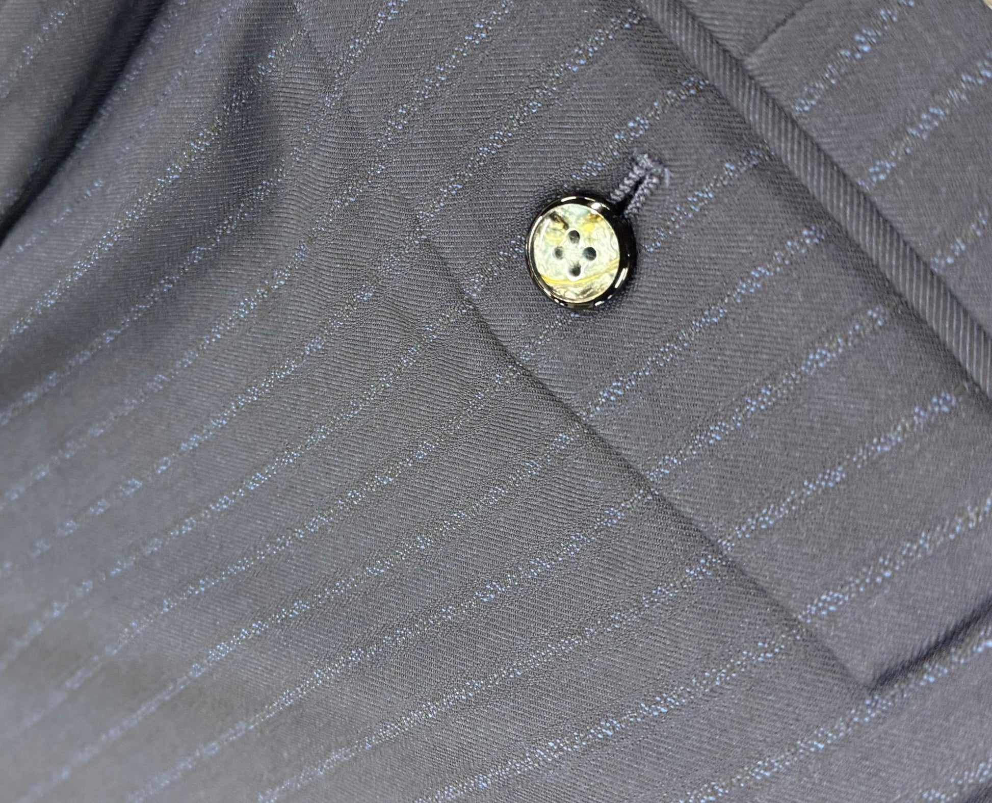 Close up suit pants back pocket button detail navy pinstripe 