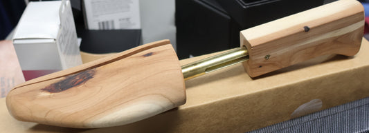 Men’s cedar shoe trees inserted in dress shoes, wooden shoe shaper for maintaining shoe structure