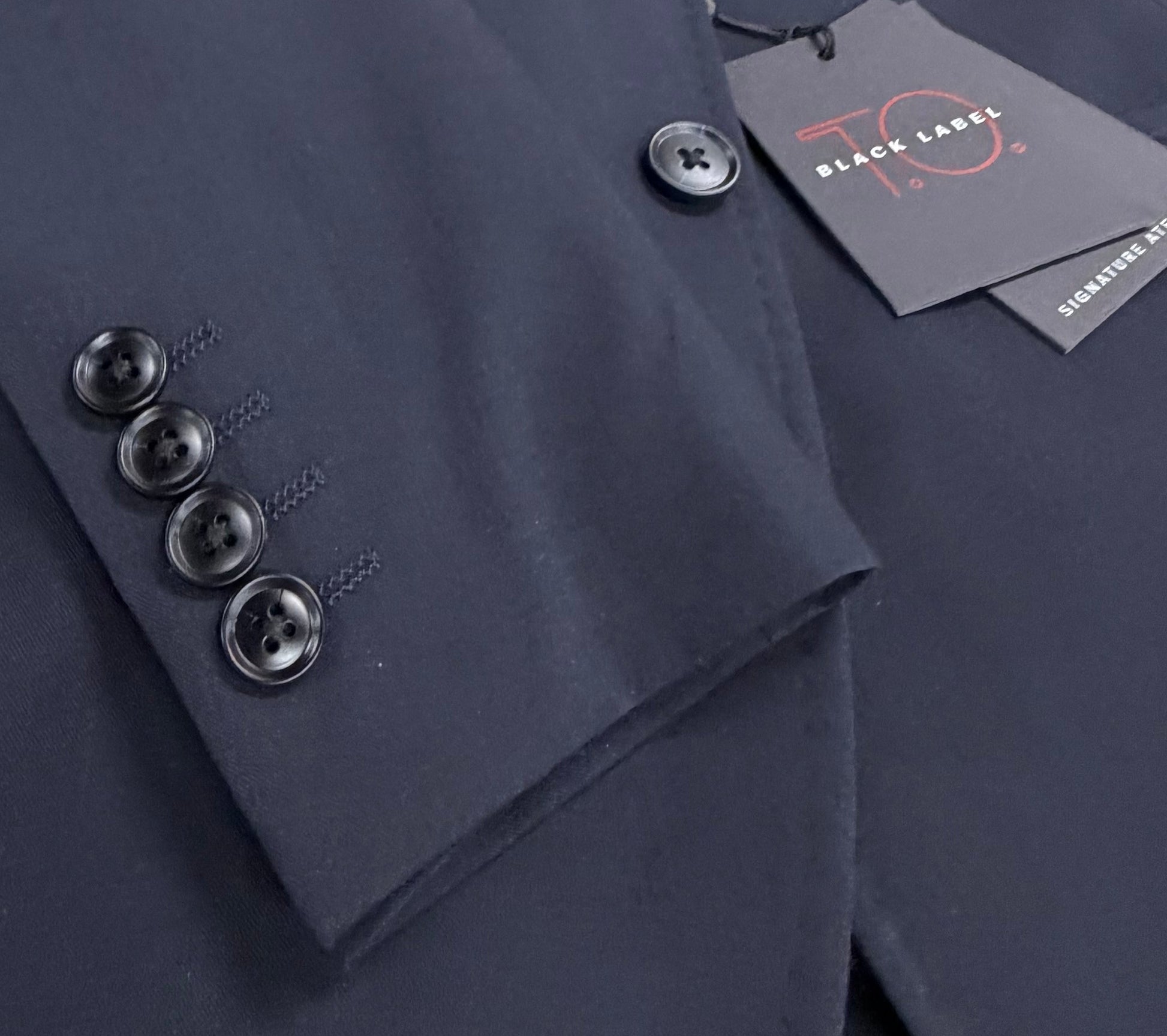 Navy suit jacket sleeve buttons