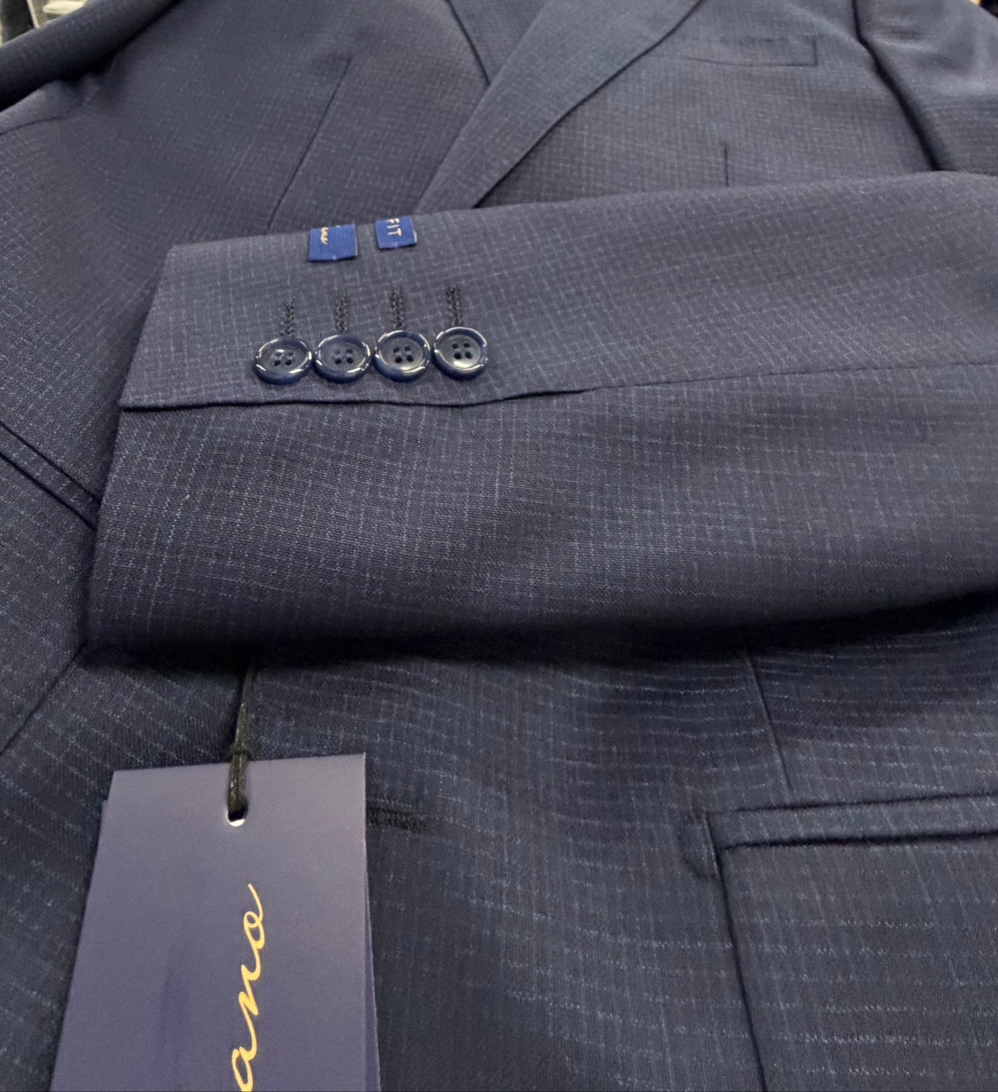 Navy suit jacket sleeve with buttons