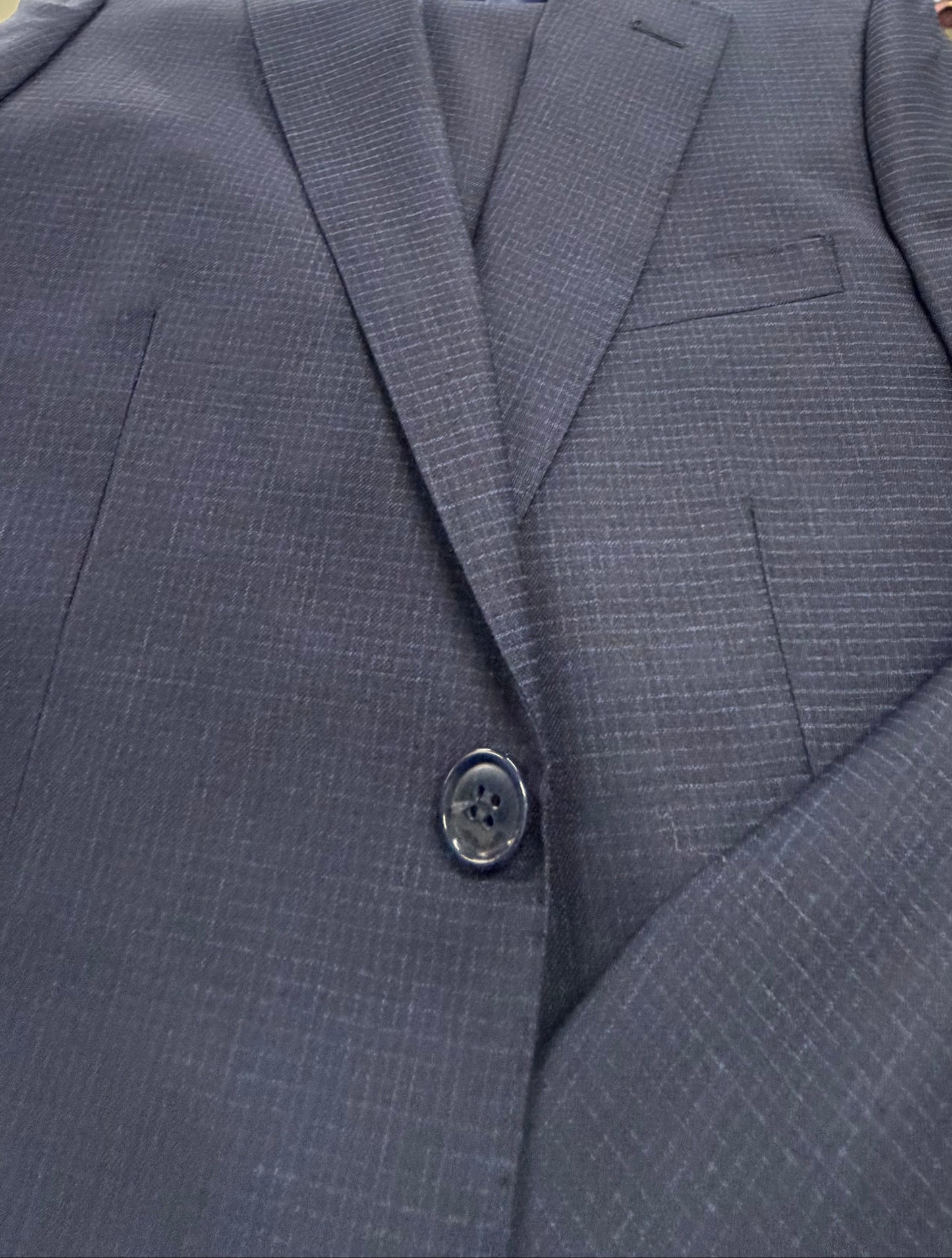 Close-up of a blue suit jacket with button