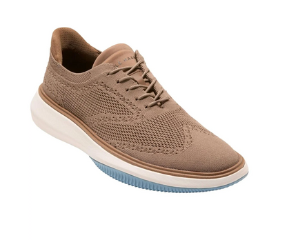 Coffee Cole Haan sneaker with white sole on a white background